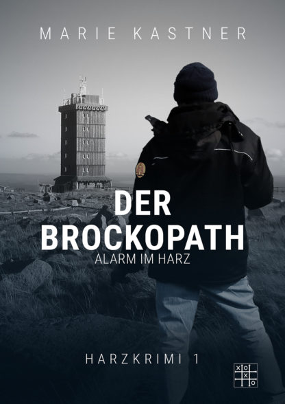 Das Cover zu Harzkrimi (1) - Der Brockopath von Marie Kastner. Ein Mann steht vor dem Turm auf dem Brocken im Harz.